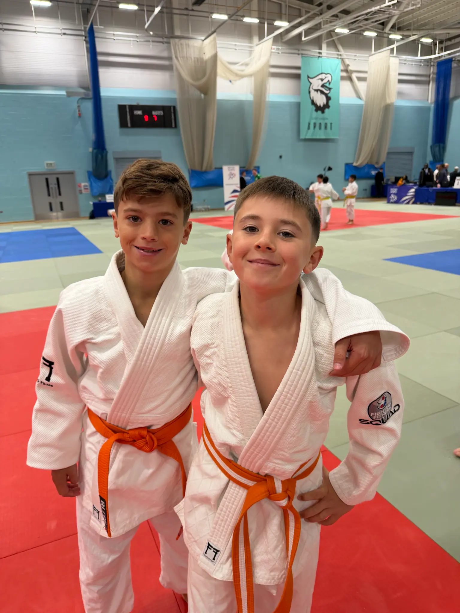 Two Fighting Fitness Judo Pathway Squad members in judogi at the British Minors Judo Championships