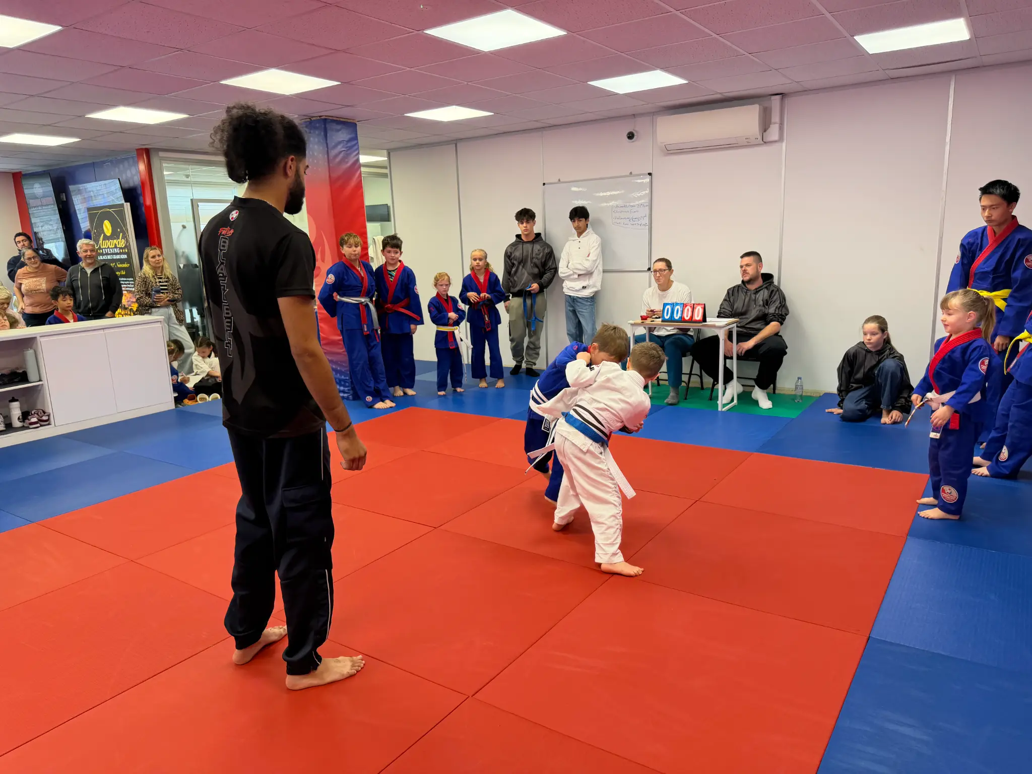 Two young judoka beginning a friendly Team Festival battle