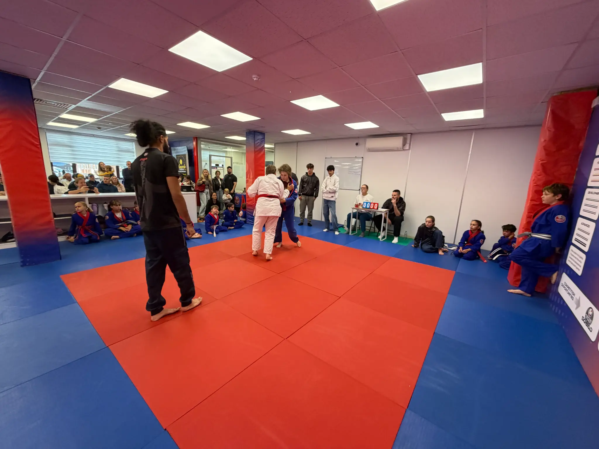 Children and parents watching a Team Festival battle