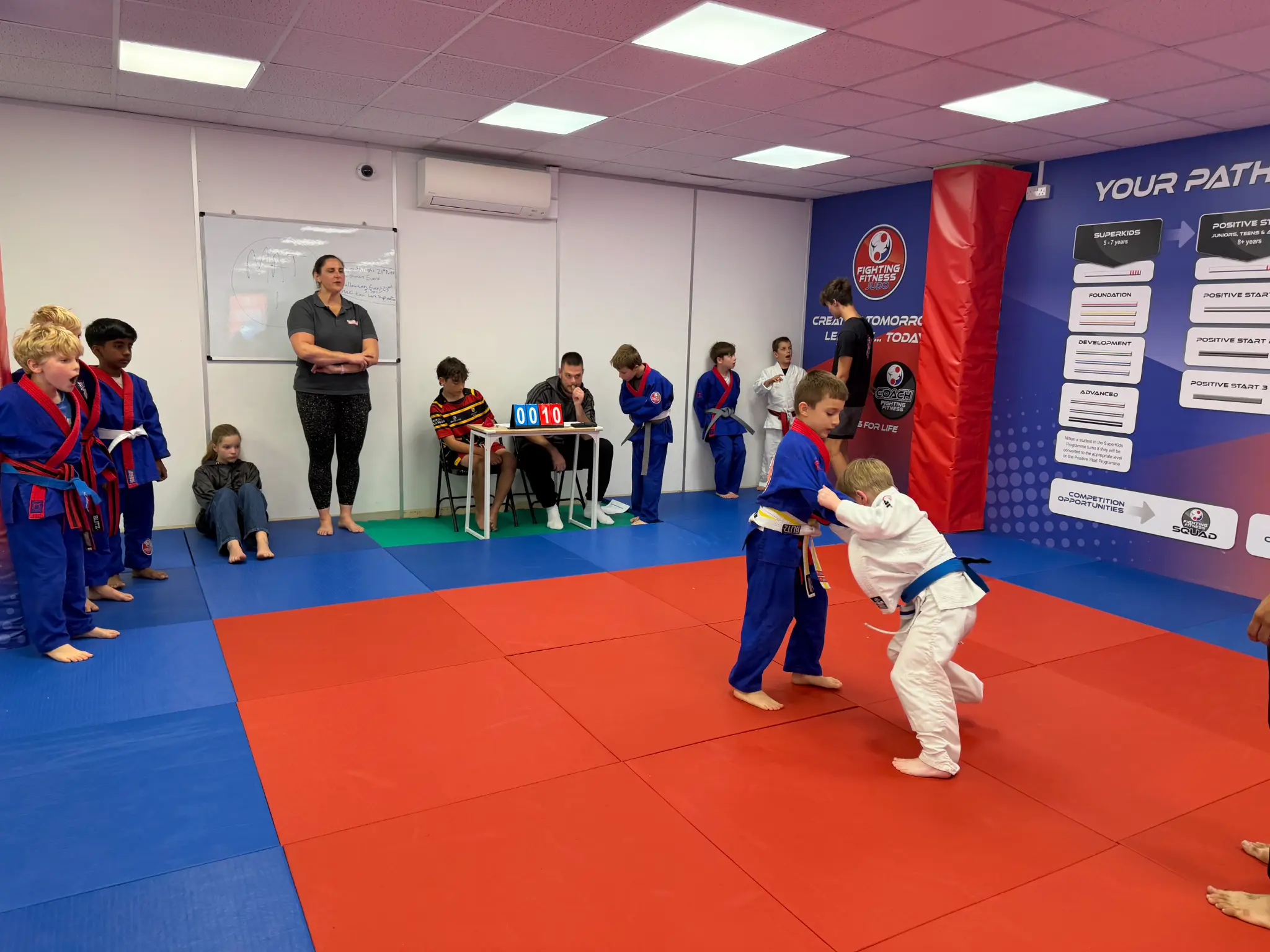 Two young judoka taking part in a carefully matched Team Festival battle