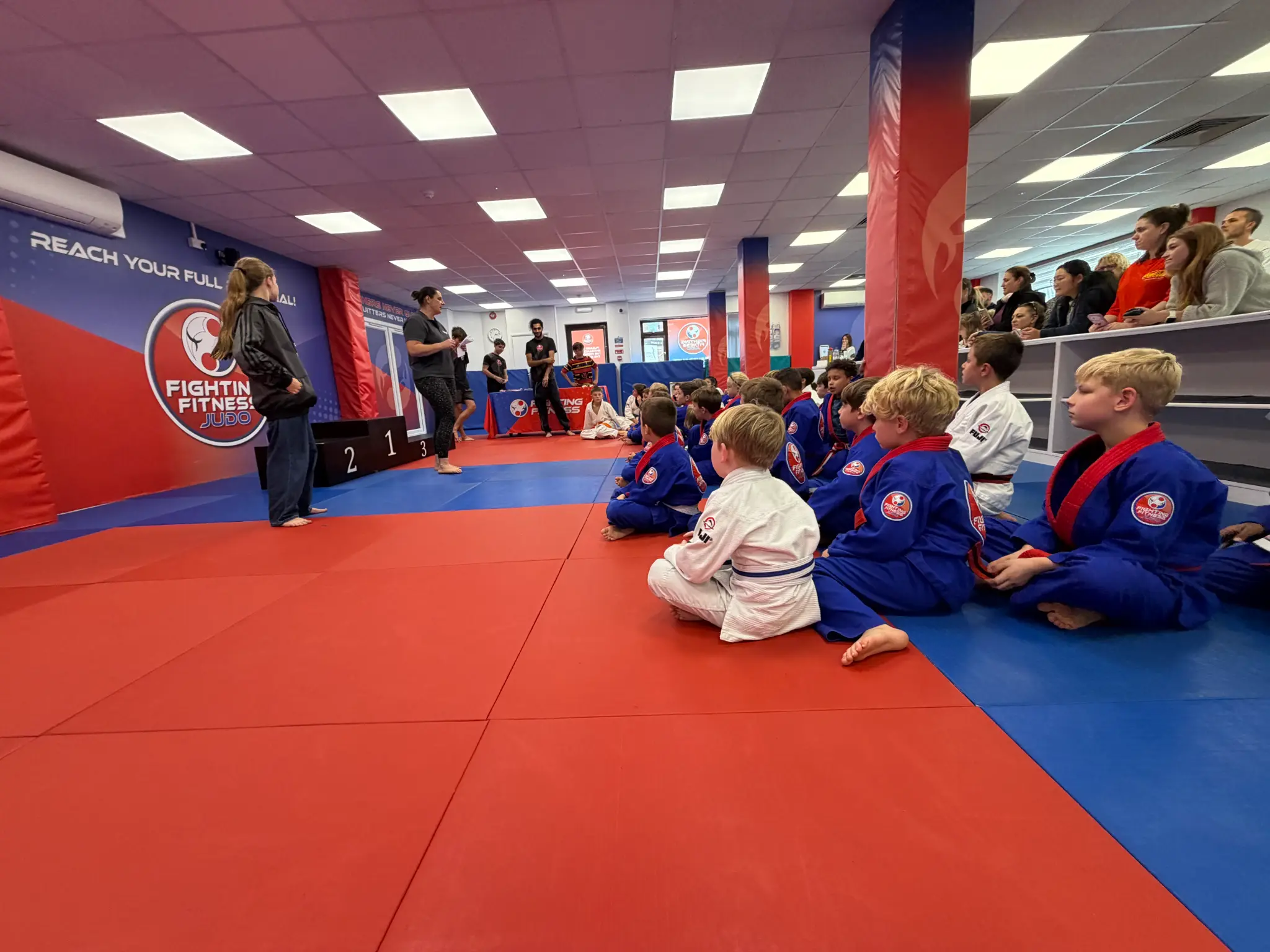 Children waiting and supporting the next Team Festival battle