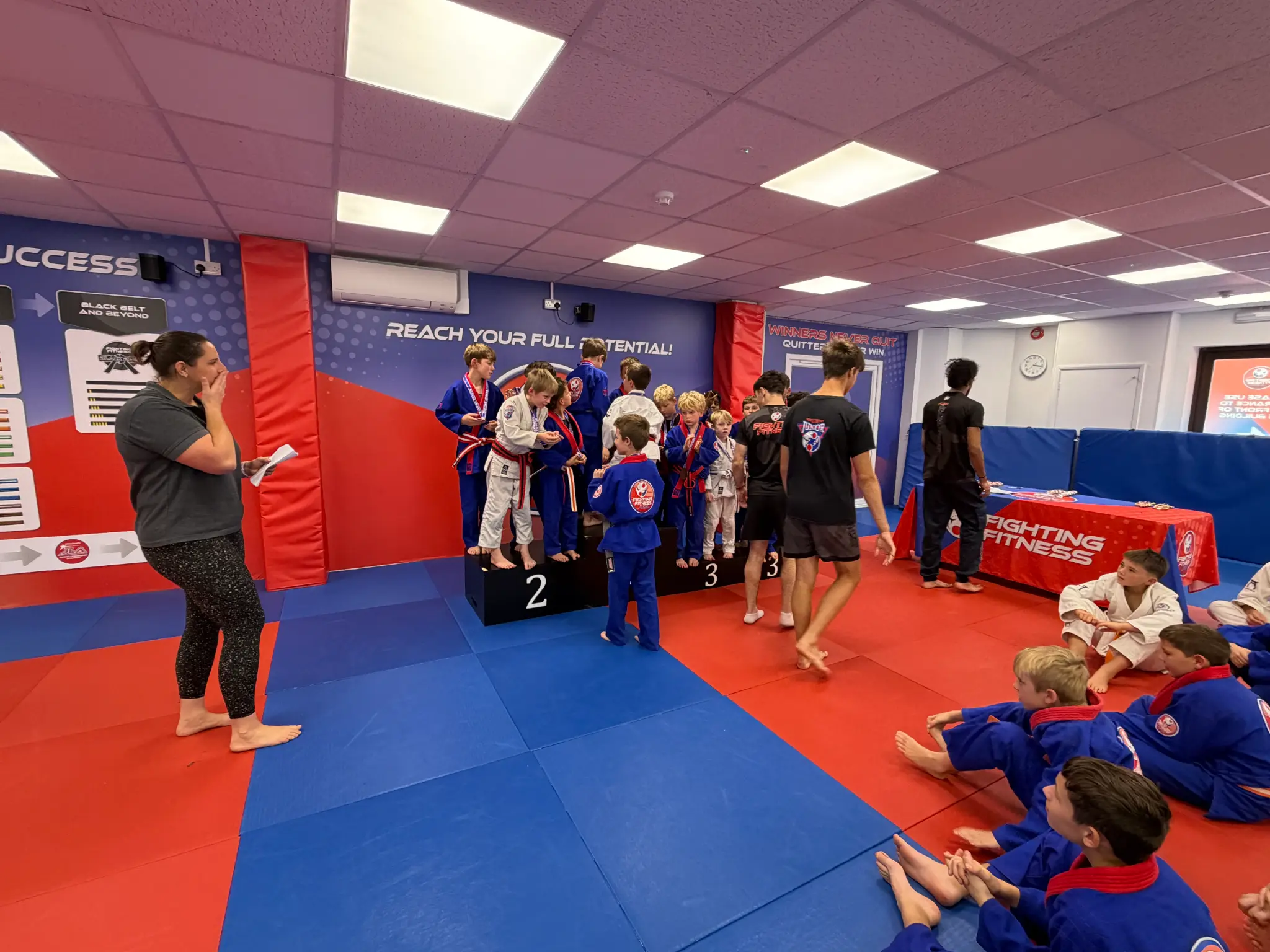Young judoka receiving team festival medals